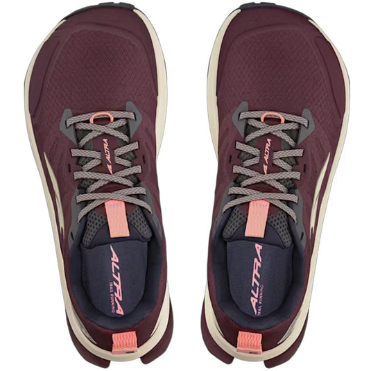 Maroon running shoes with gray and pink accents on a white background