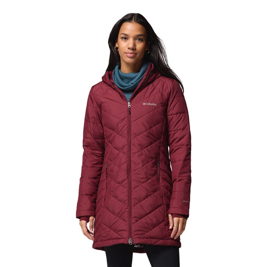 Woman wearing a maroon quilted jacket on a white background