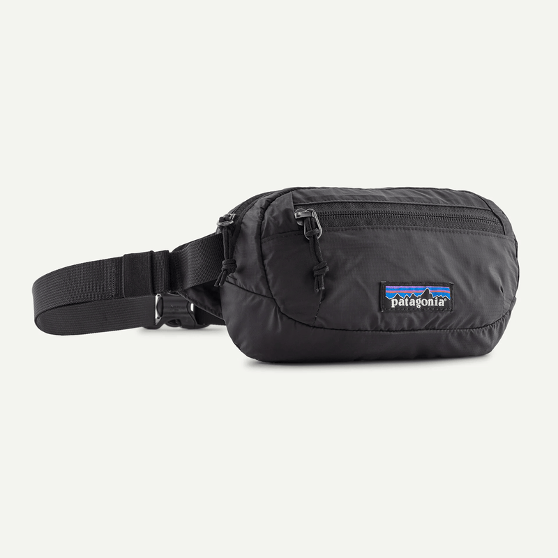 Load image into Gallery viewer, Black waist bag with Patagonia logo on a white background