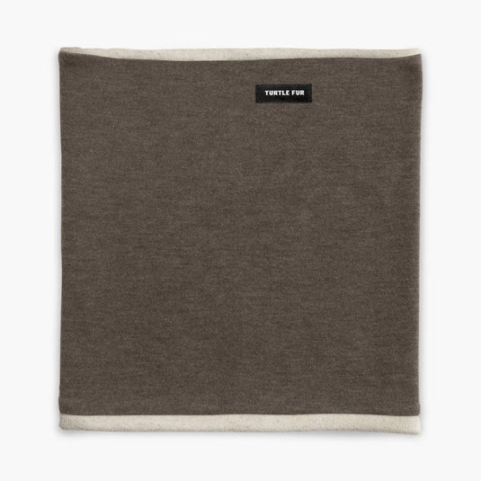 Brown neck gaiter with a brand label on a white background