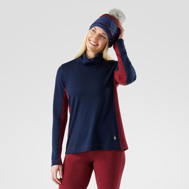 Load image into Gallery viewer, Woman wearing a navy long-sleeve top and red pants with a matching beanie on a light gray background