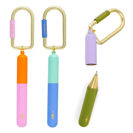 Colorful keychains and a pen on a white background