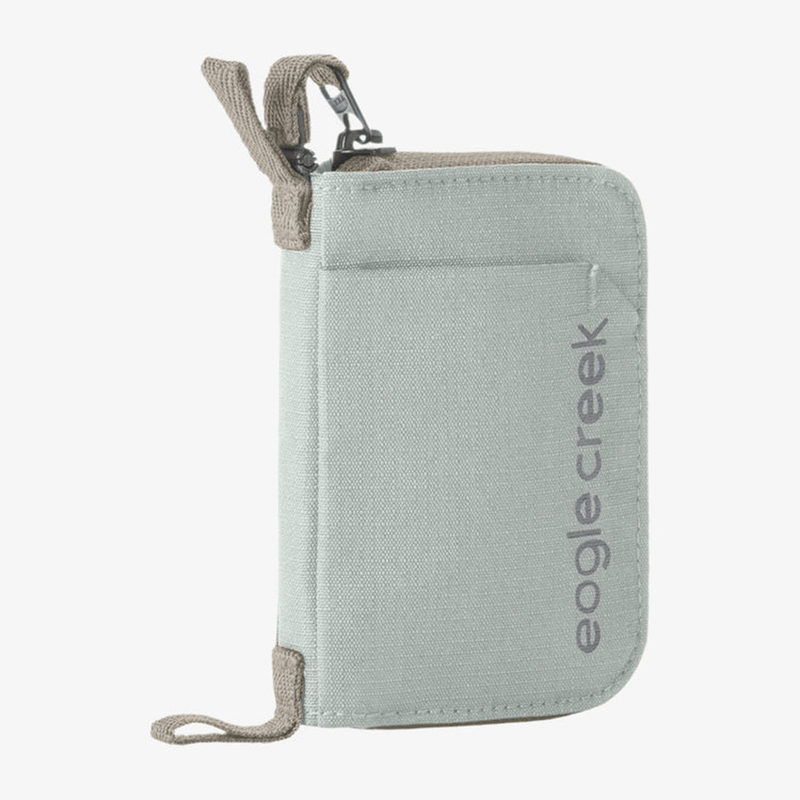 Load image into Gallery viewer, Light gray travel wallet with beige accents and 'eagle creek' branding on a white background