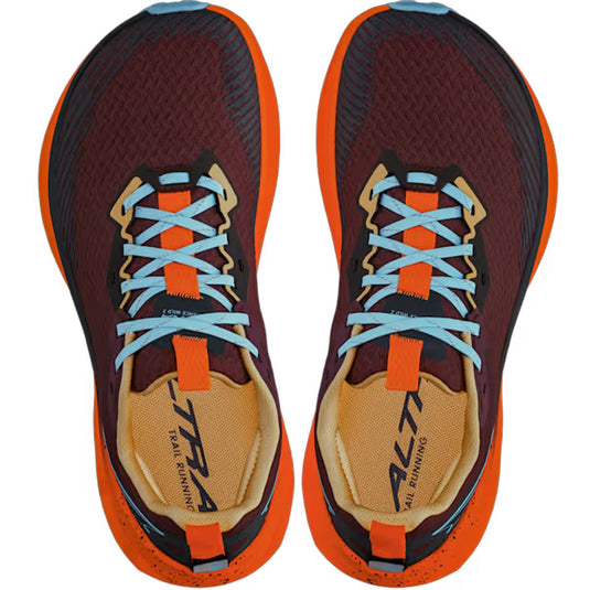 Pair of maroon and orange running shoes with blue laces on a white background