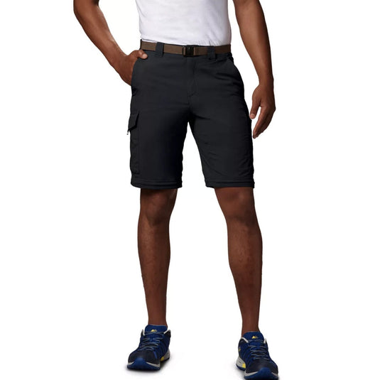 Person wearing black shorts on a white background