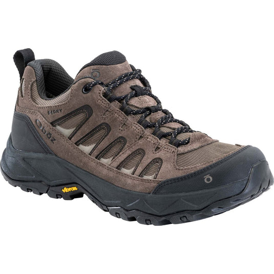 Brown hiking shoe with black sole on a white background