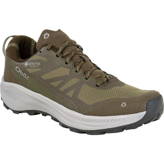 Green hiking shoe with brand logo on a white background