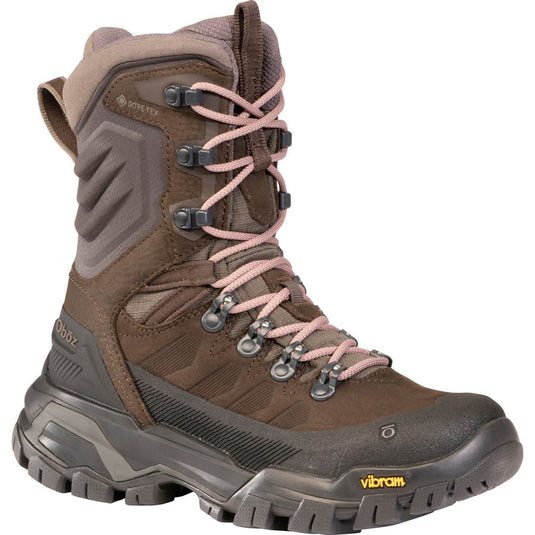 Brown hiking boot with pink laces on a white background
