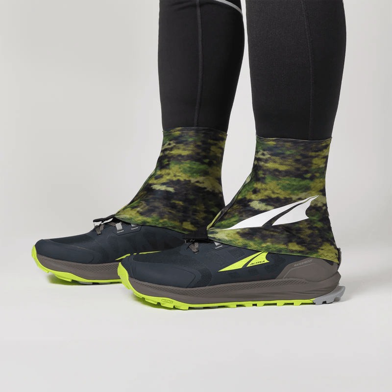 Load image into Gallery viewer, Black and green camouflage shoe covers with a brand logo on a light gray background