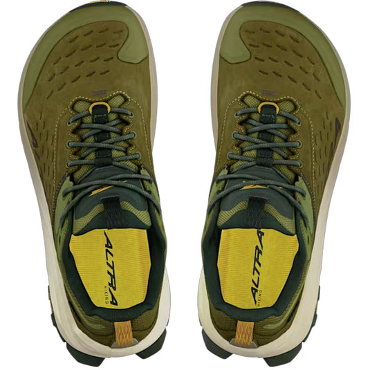 Green hiking shoes with yellow accents on a white background