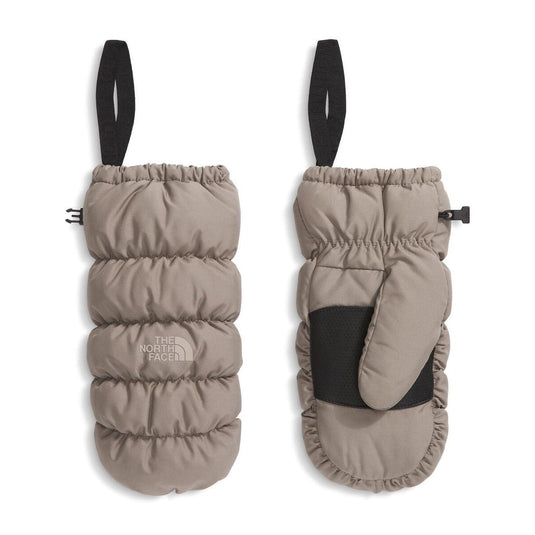 Pair of beige mittens with black straps on a white background, featuring The North Face logo.