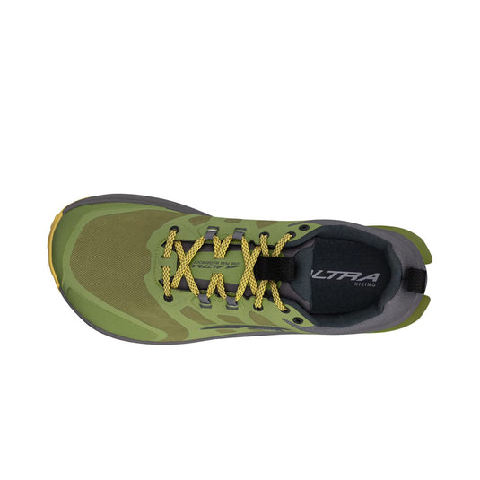 Green and gray athletic shoe with yellow laces on a white background