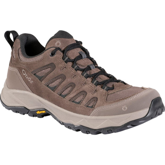 Brown hiking shoe with black laces on a white background