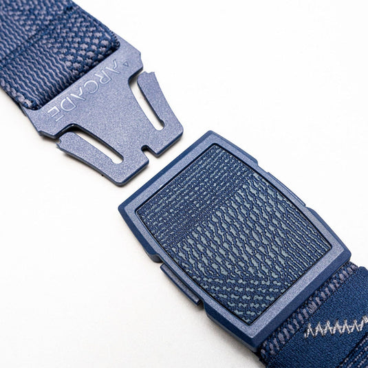 Close-up of a blue belt with a buckle on a white background