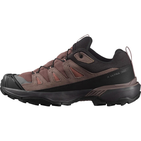 Brown and black hiking shoe on a white background