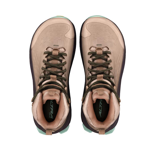 Pair of brown hiking boots with green accents on a white background