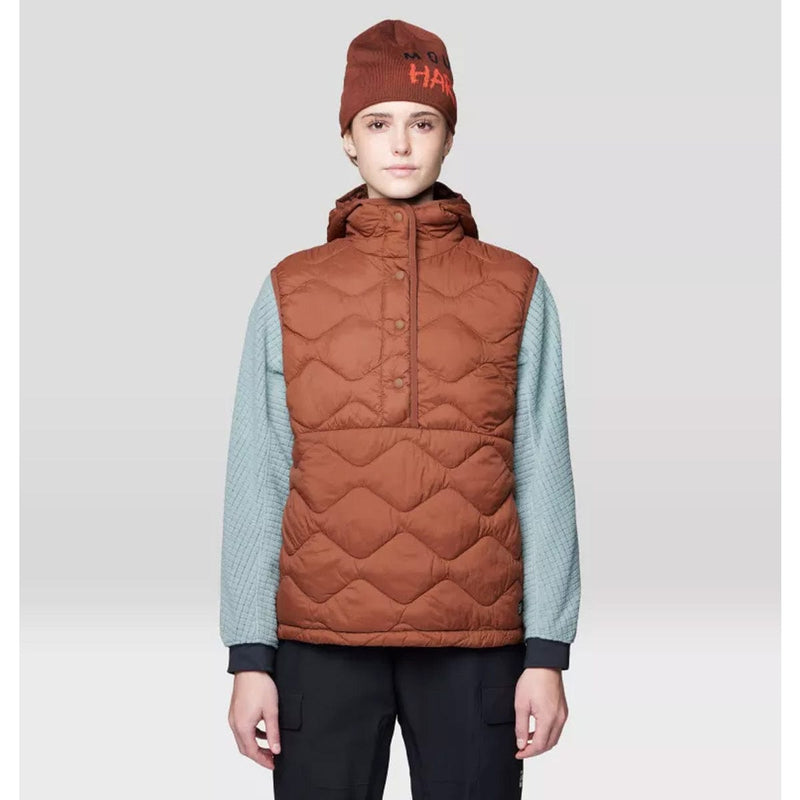 Load image into Gallery viewer, Person wearing a brown quilted vest and beanie on a light gray background