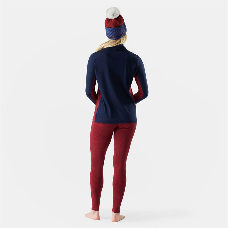 Load image into Gallery viewer, Person wearing a navy long-sleeve top and red leggings with a patterned beanie on a white background