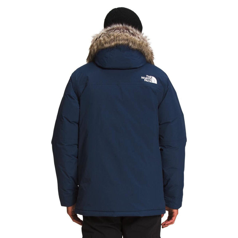 Load image into Gallery viewer, Blue winter jacket with fur hood on a white background