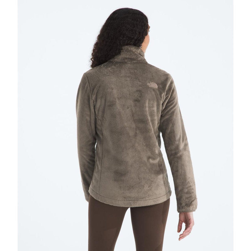 Load image into Gallery viewer, Person wearing a brown fleece jacket with a visible brand logo on a white background