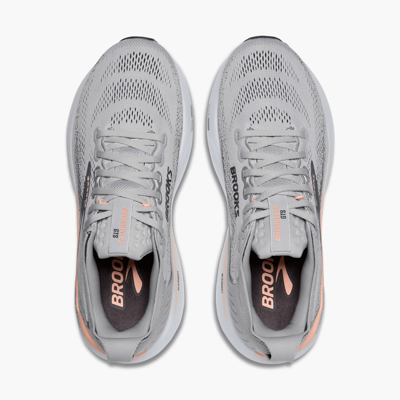 Load image into Gallery viewer, Pair of gray running shoes with 'Brooks' branding on a white background