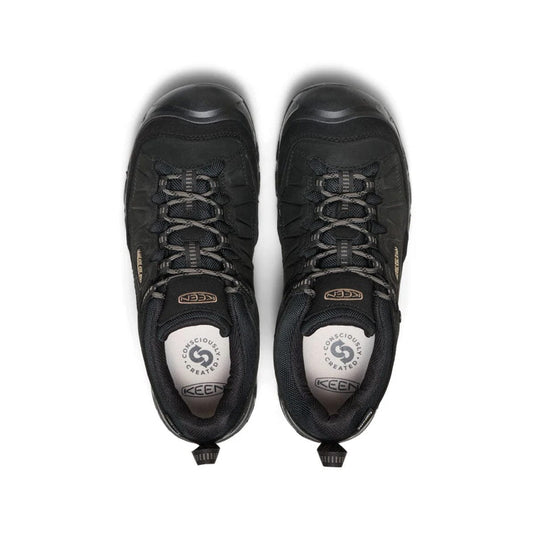 Pair of black KEEN hiking shoes on a white background