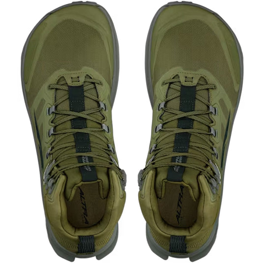 Pair of green hiking boots with laces on a white background