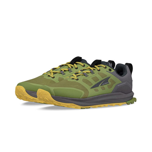 Green and yellow running shoe on a white background