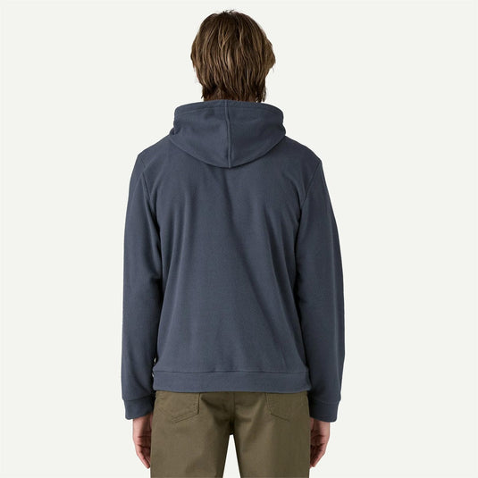 Person wearing a blue hoodie from behind on a white background