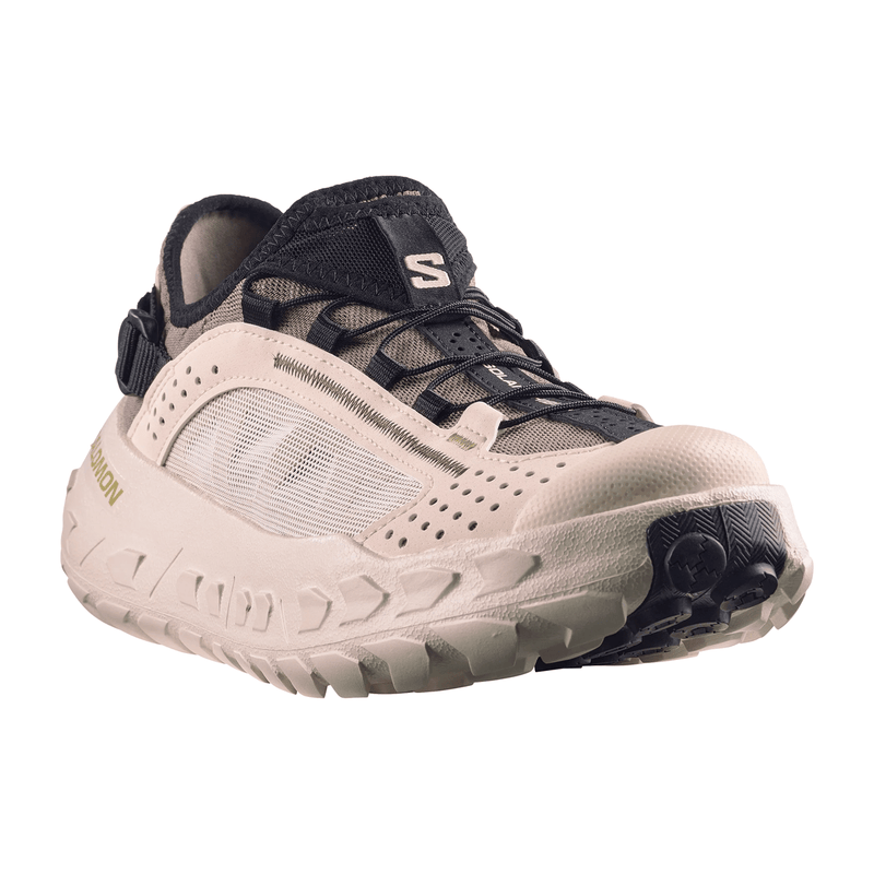 Load image into Gallery viewer, Beige and black athletic shoe on a white background