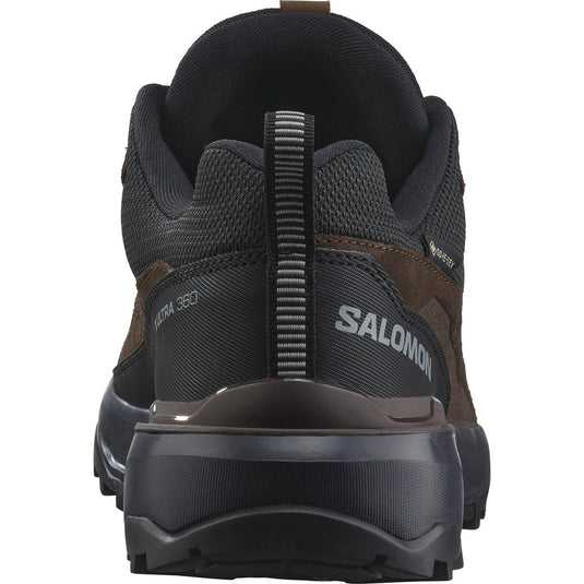 Black and brown Salomon hiking shoe on a white background