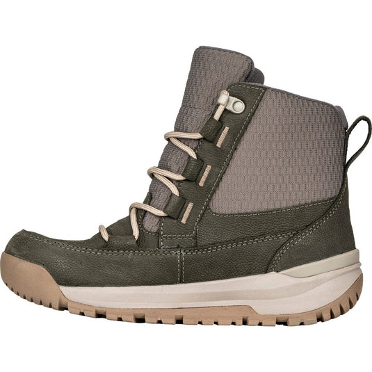 Green hiking boot with beige sole on a white background