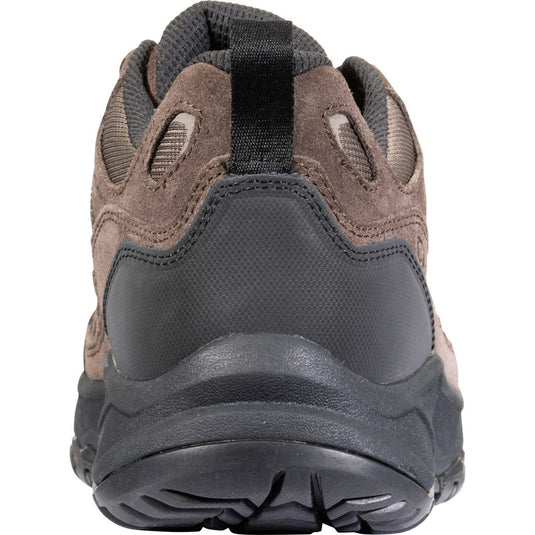 Brown and black hiking shoe on a white background