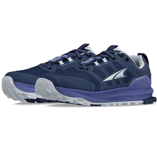 Navy and gray running shoes with a visible brand logo on a white background