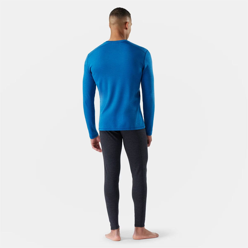 Load image into Gallery viewer, Man wearing a blue long-sleeve top and black pants on a white background