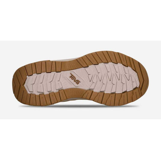 Brown sole of a shoe with visible brand logo on a white background