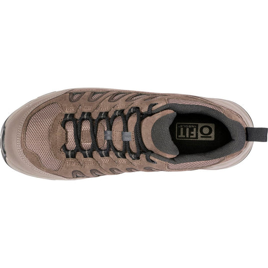 Brown sneaker with black laces on a white background