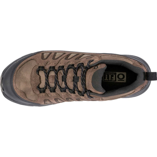 Brown hiking shoe with black laces on a white background
