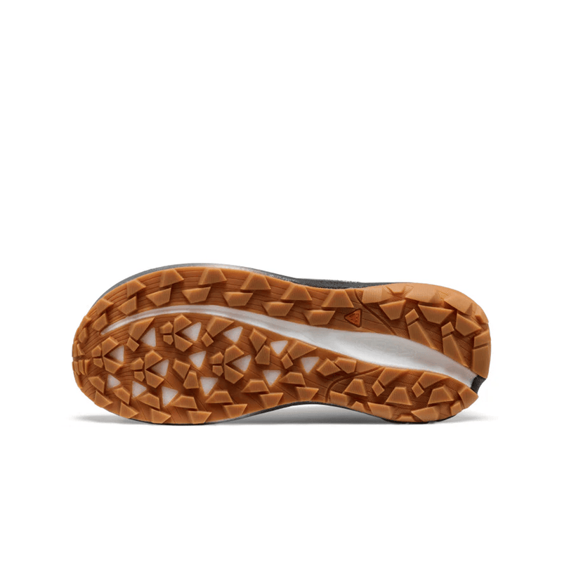 Load image into Gallery viewer, Close-up of a shoe sole with brown tread pattern on a white background