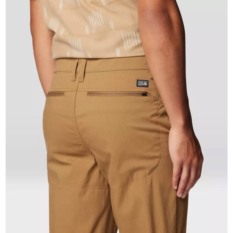 Load image into Gallery viewer, Tan pants with a brand logo on a white background