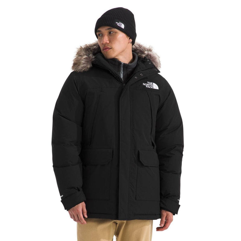 Load image into Gallery viewer, Person wearing a black coat with fur hood and matching hat on a white background