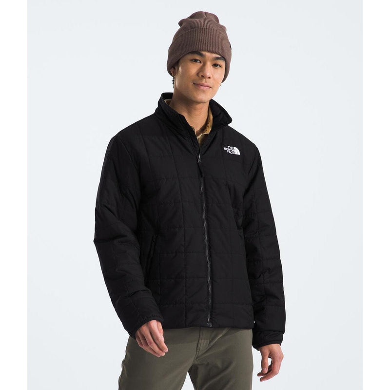 Load image into Gallery viewer, Person wearing a black jacket with a brand logo on a white background