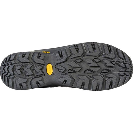 Close-up of a shoe sole with a textured pattern and a yellow accent on a white background