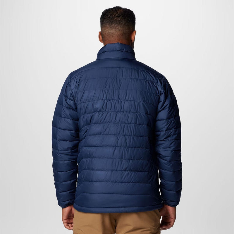 Load image into Gallery viewer, Man wearing a blue puffer jacket on a white background