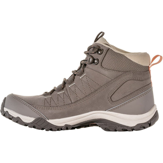 Gray hiking boot with a white sole on a white background