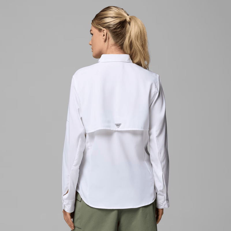 Load image into Gallery viewer, Woman wearing a white shirt with a brand logo on a gray background
