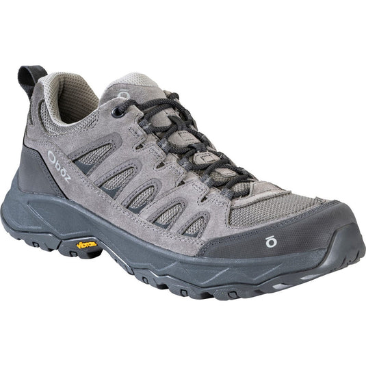 Gray hiking shoe with brand logo on a white background