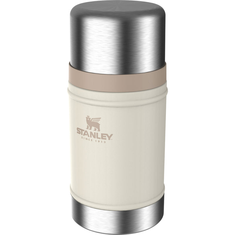 Load image into Gallery viewer, A Stanley vacuum-insulated bottle with a cream-colored body, a brushed silver stainless steel top and bottom, and a beige band around the middle. The Stanley logo is printed on the front.
