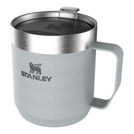 Gray insulated mug with silver lid and handle, featuring Stanley logo on a white background