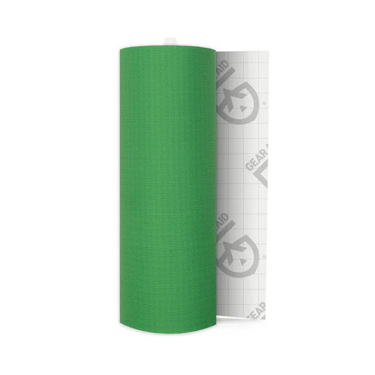 Green roll of paper with a white label on a white background